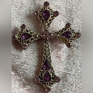 Unmarked gold tone with pink and purple rhinestones.
